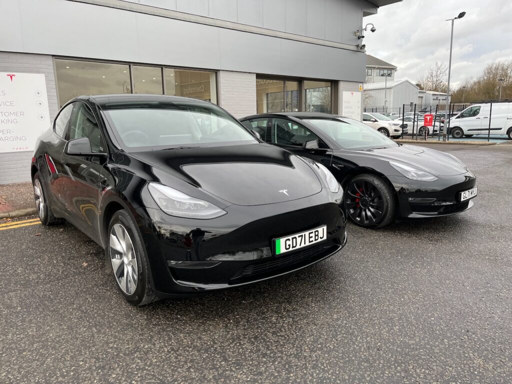 Two Black Tesla cars